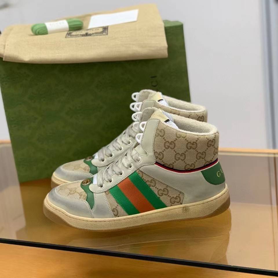 Gucci High-top Distressed sneakers